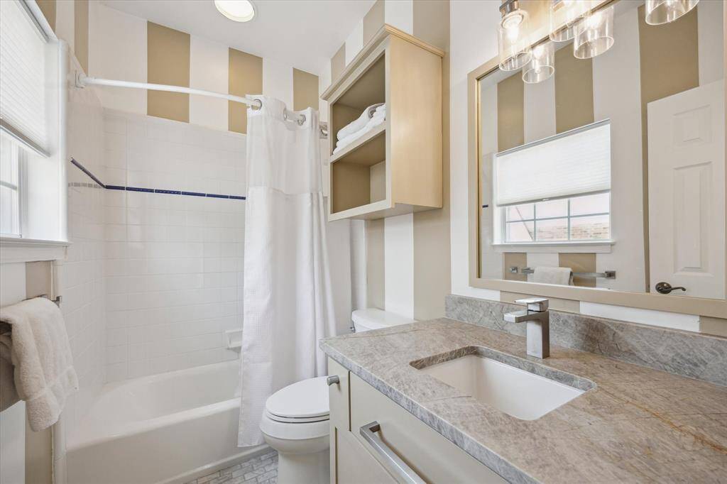 Full bath on the 2nd floor for secondary bedroom. New countertops, sink, faucets and toilet.