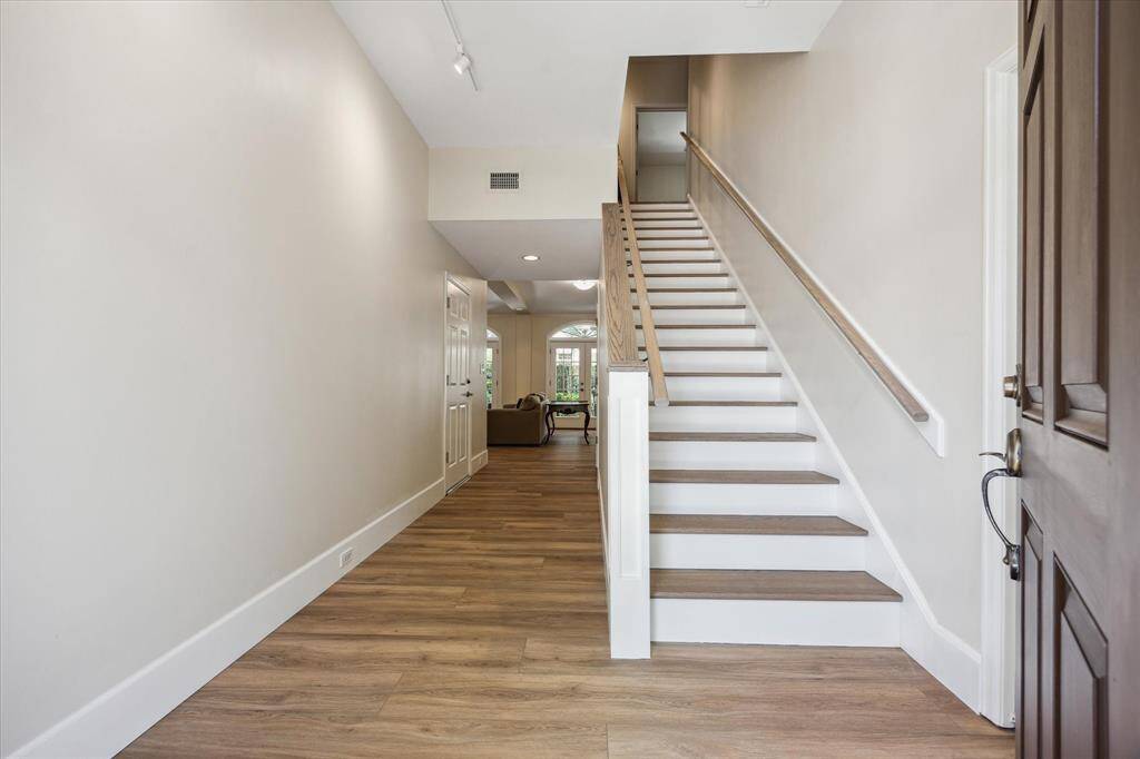 Entering this inviting home from the front door looking toward the family room. Office/study on the right