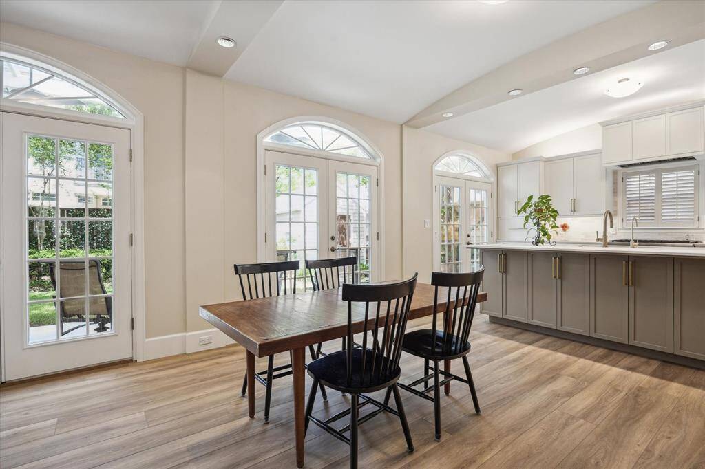 Another view of the dining area and kitchen