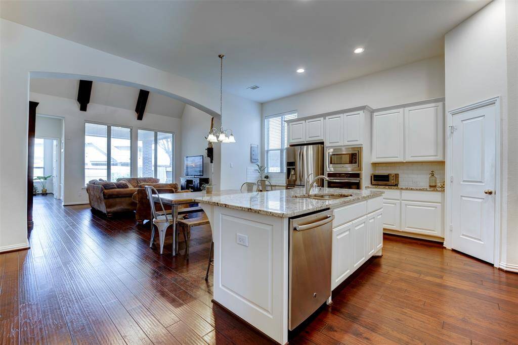 This open-concept floor plan is perfect for entertaining, offering easy access to the main living areas
