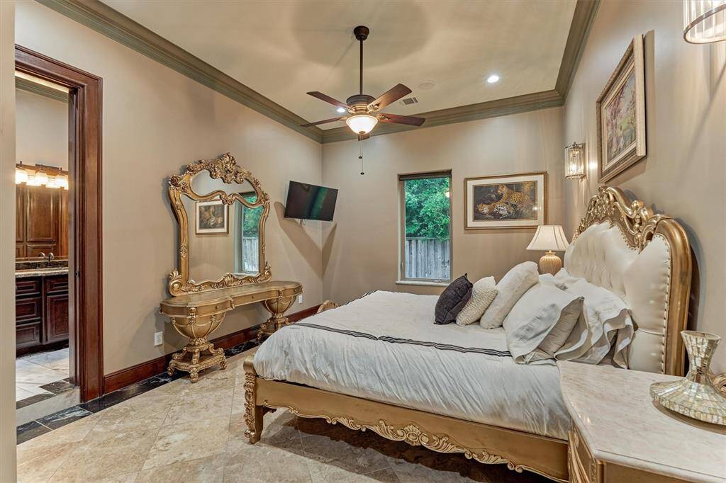 Bright and roomy guest suite featuring timeless Italian flair and direct access to a beautifully appointed shared bath.