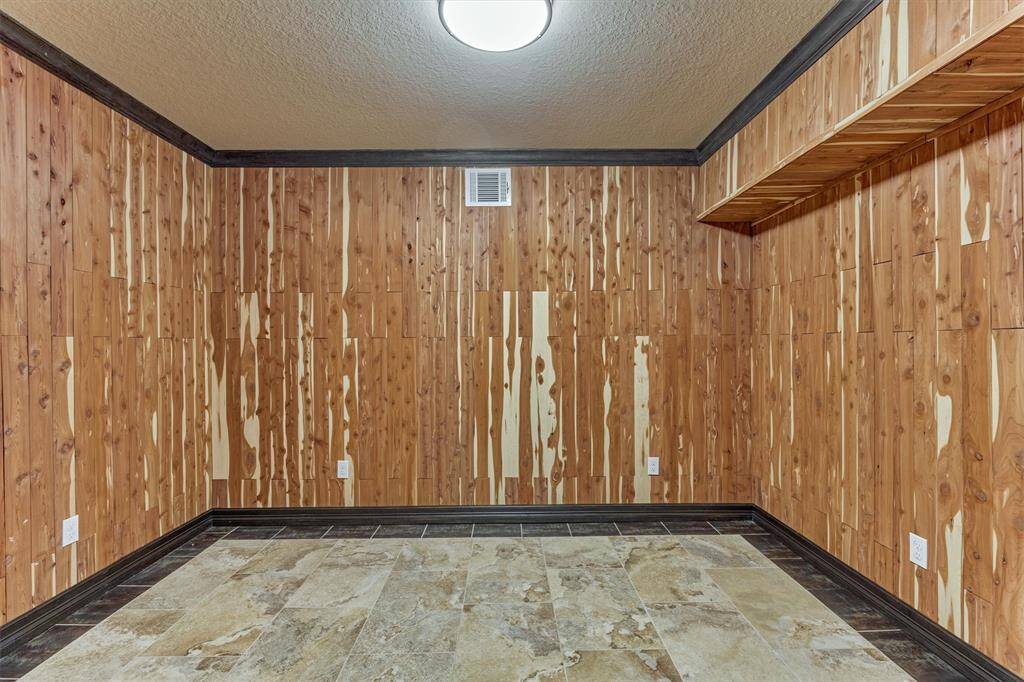 Cedar lined massage room with rich wood tones.