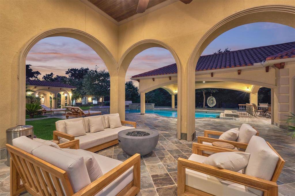 Spacious covered patio with fans and recessed lighting—perfect for lounging, dining, and taking in the lake views.