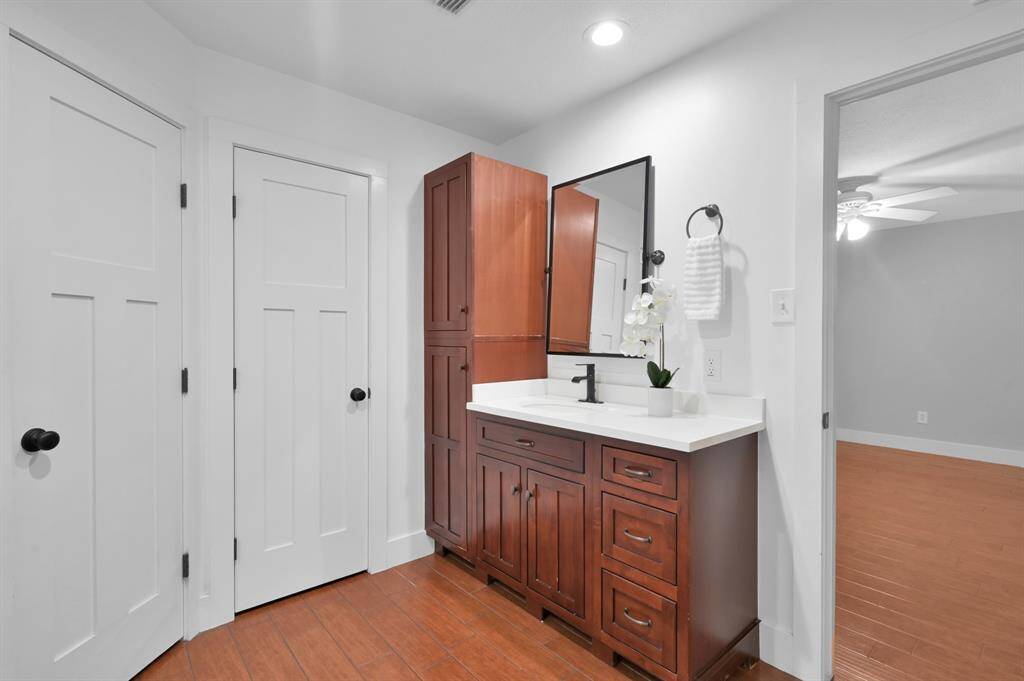 The primary bathroom has his & hers closets as well as an extra-large linen closet.