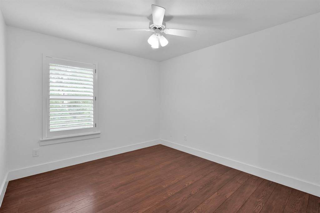 The second secondary bedroom upstairs also has a nice sized closet & window with plantation shutters.