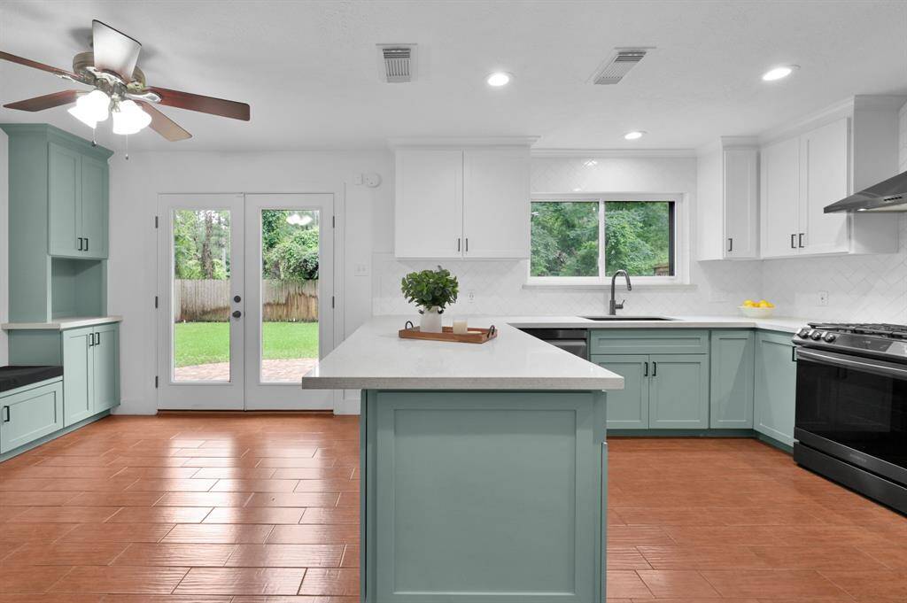 This newly renovated bright & airy kitchen features quartz countertops and is perfect for entertaining.