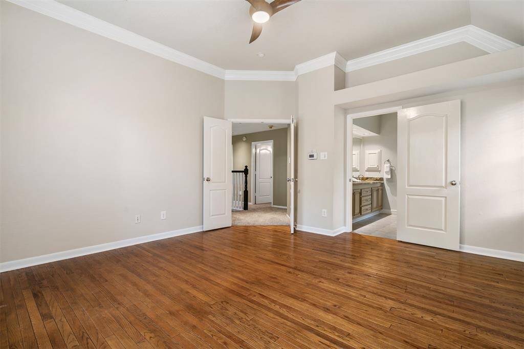 Primary bedroom leading to the bath.  The floors are reclaimed wood and beautiful.