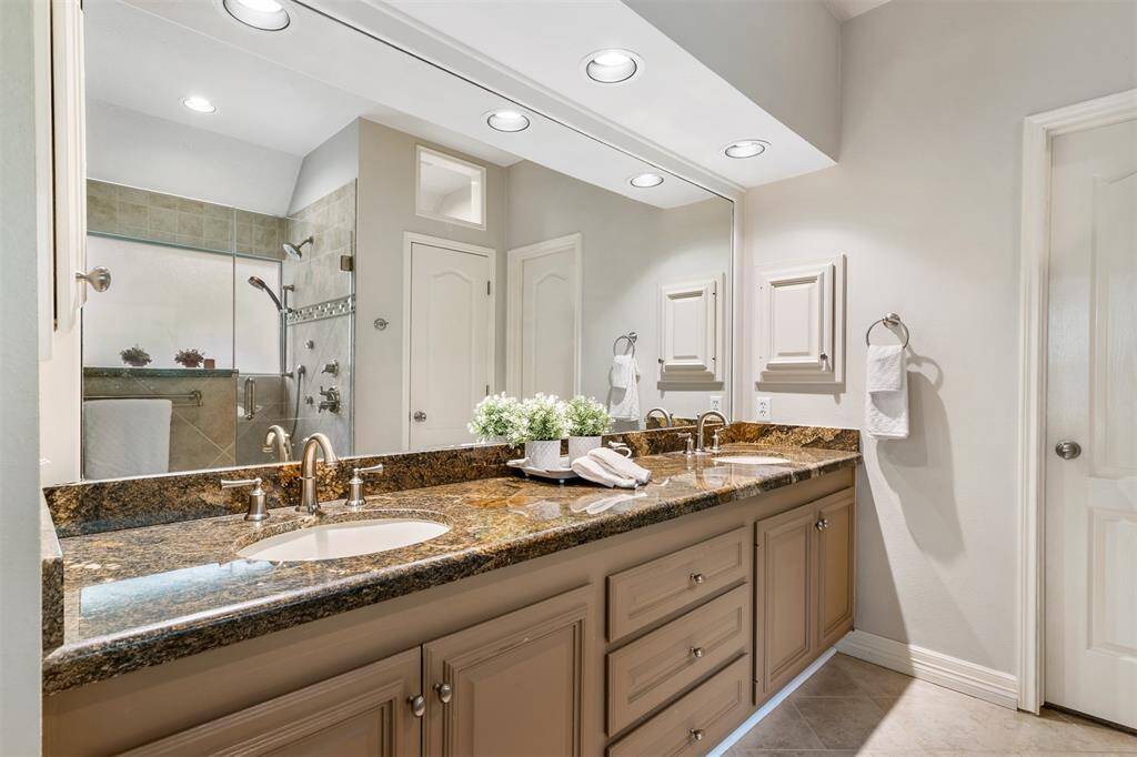 Primary bathroom is updated and spotlessly clean.