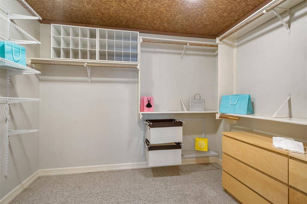 Huge walk in Primary closet with a cedar lined ceiling.  Lots of built in storage for your enjoyment.