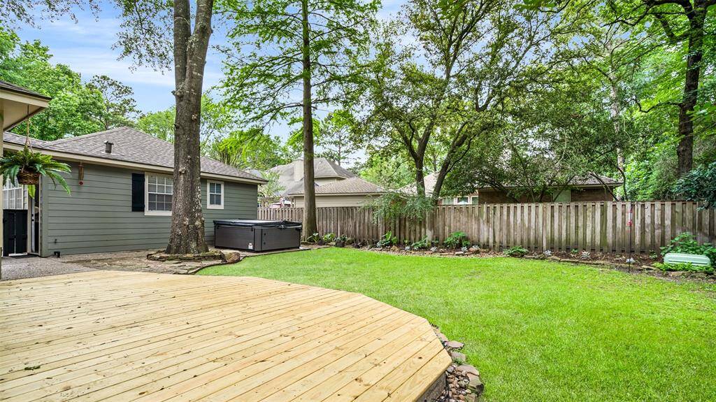 Lovely back yard and new wood decking.  Please note the hot tub will be removed and is not included with the lease.