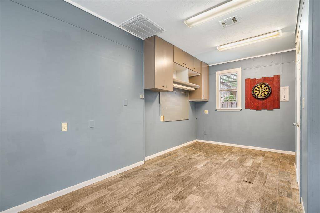 Check out this awesome extra room!!  Great workshop, work out room, full AC and a 1/2 bath.