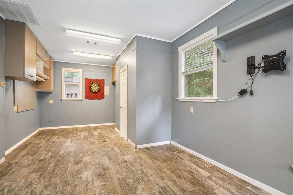 Check out this awesome extra room!!  Great workshop, work out room, full AC and a 1/2 bath.
