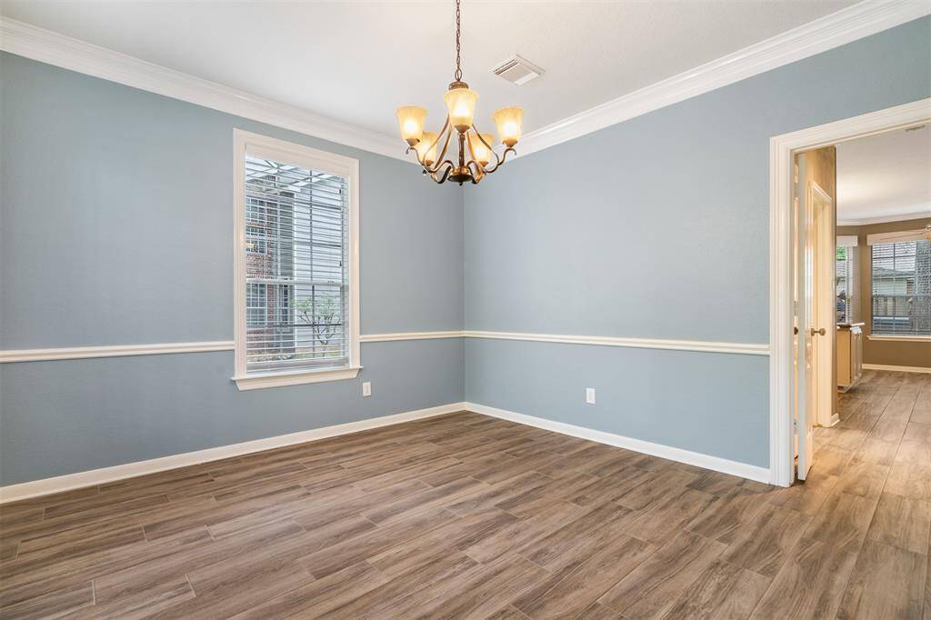 The dining area offers solid surface flooring.  Easy to maintain and enjoy family dinners while enjoying the beautiful front yard view.