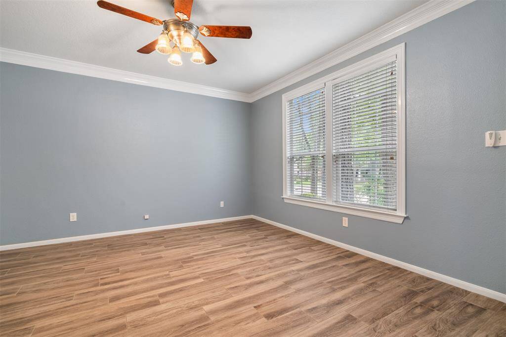 Huge home office or formal living area with lovely windows and outdoor views.