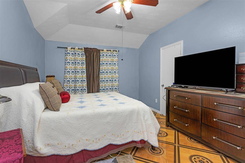 Another view of primary bedroom