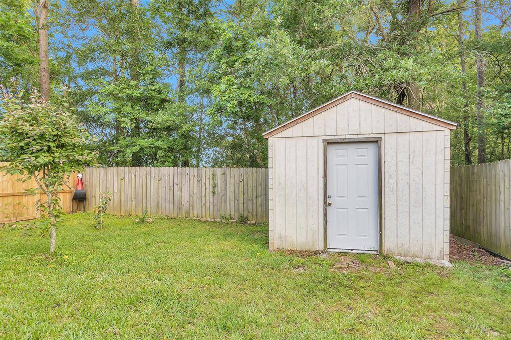 Spacious backyard includes a convenient storage shed for all your outdoor essentials.
