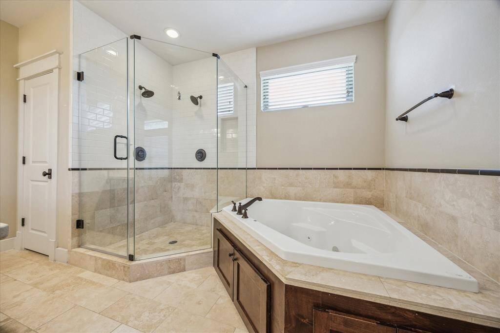 Additional view of primary bathroom.