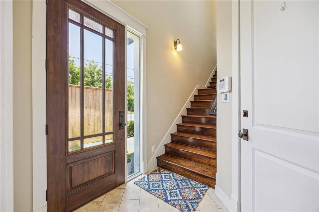 Front door leads to a landing. Gleaming hardwood floors thoughout the hoome.