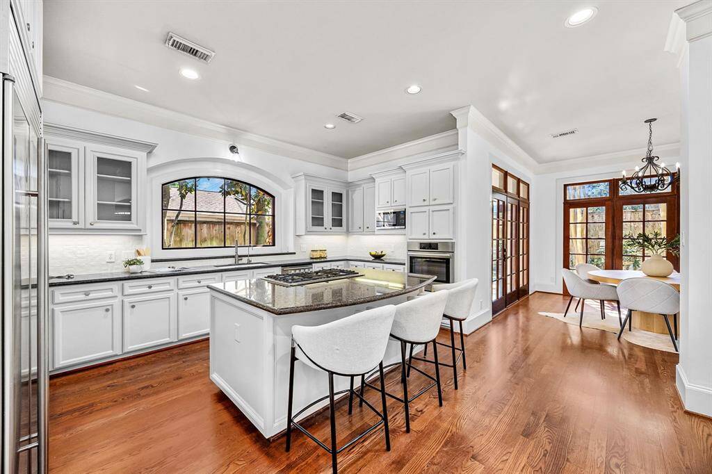 Kitchen flows naturally to the breakfast nook and formal dining