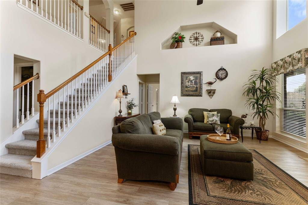 Loft stairwell overlooking living room, kitchen, and breakfast nook