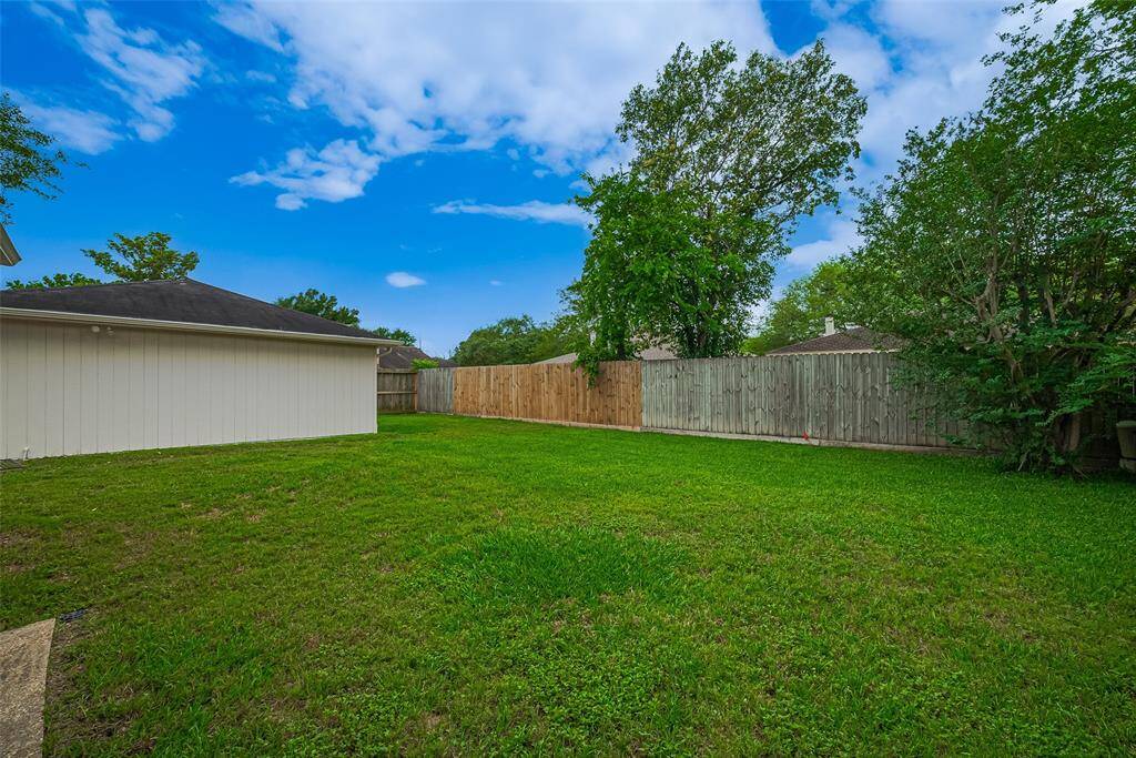 Corner lot with detached garage and large backyard.