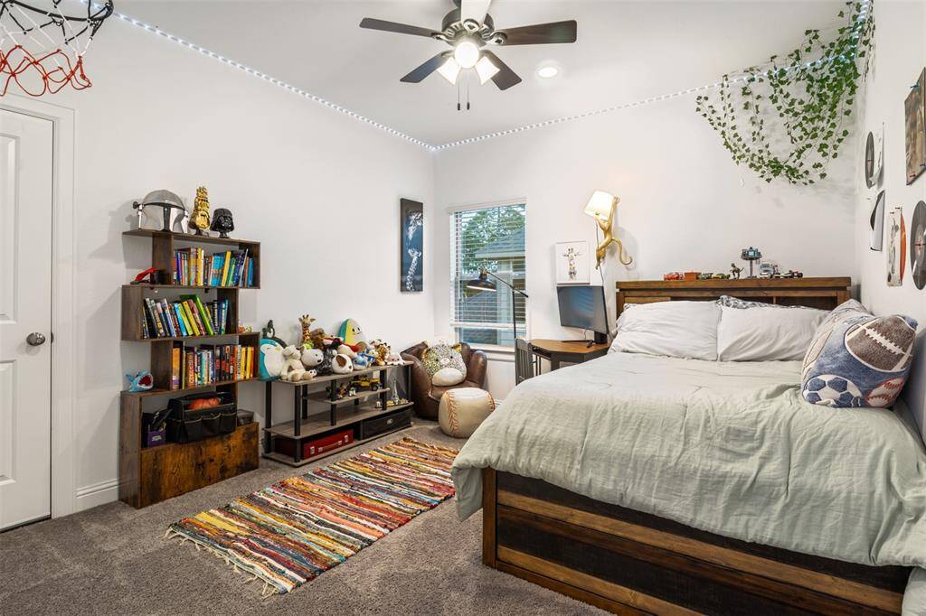 secondary bedroom upstairs with another walk in attic with wood floors for more storage!