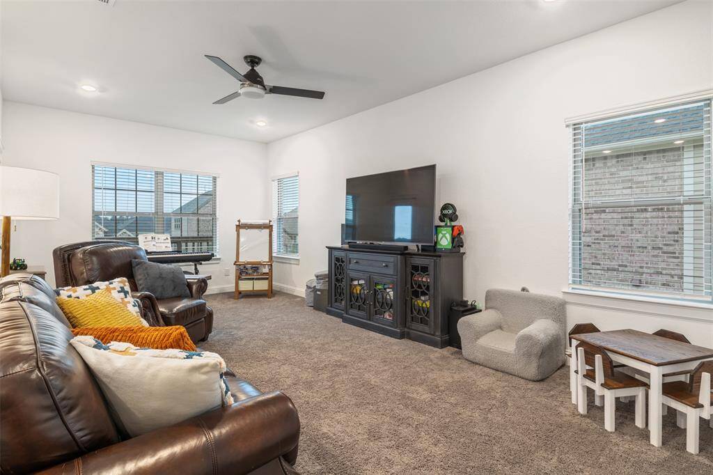 Upstairs gameroom is spacious and accommodating for a modern entertainment set up!