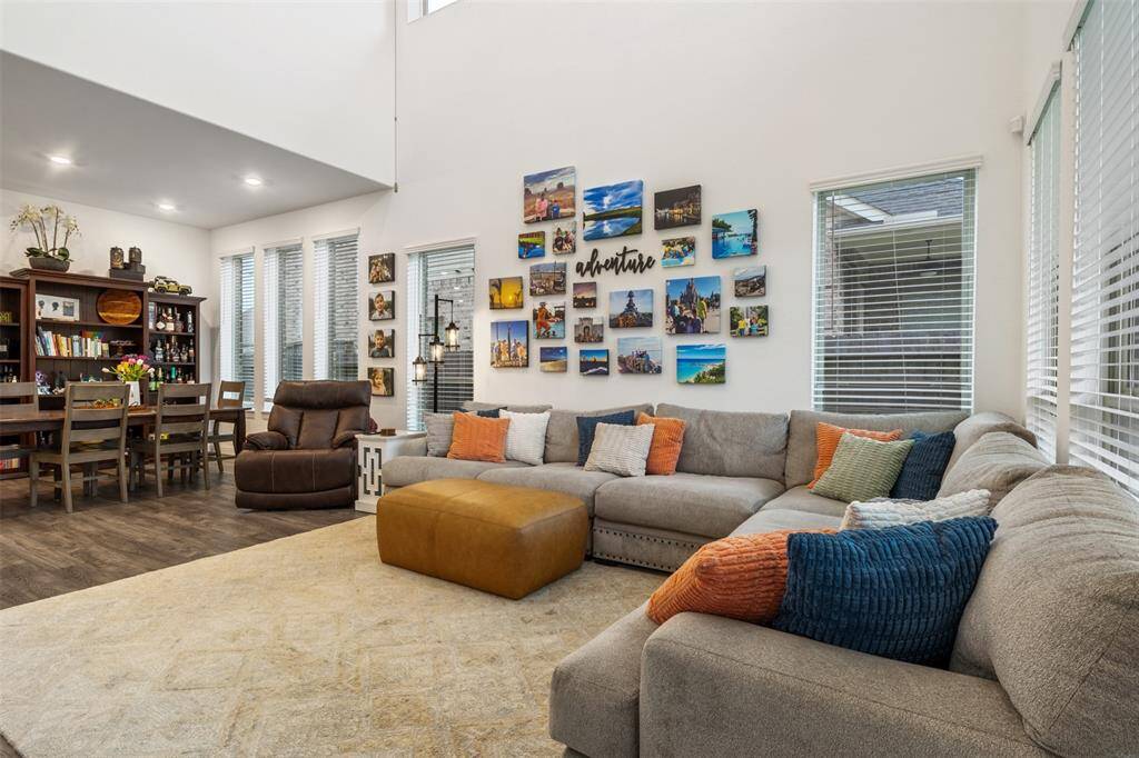 Large open living area with high ceilings is ideal for gathering and relaxing!