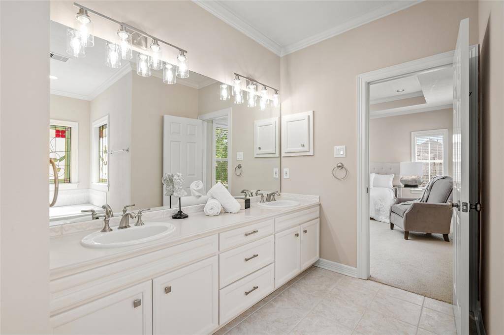 Primary bath with double sinks & 2025 lighting