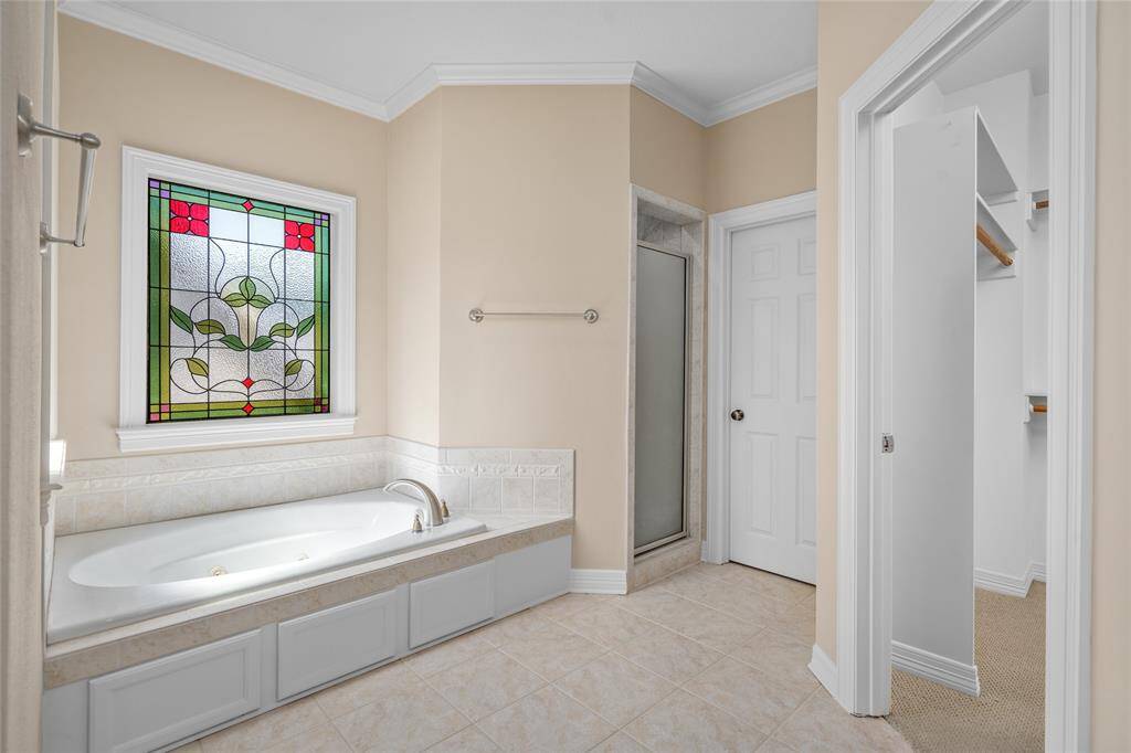 Windows overlook a private backyard, with accentuated beauty and privacy of stained glass