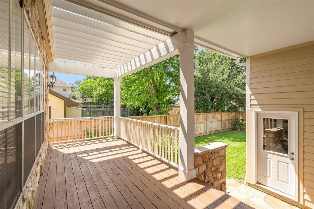 Bask in a private oasis, with covered breezeway to garage.