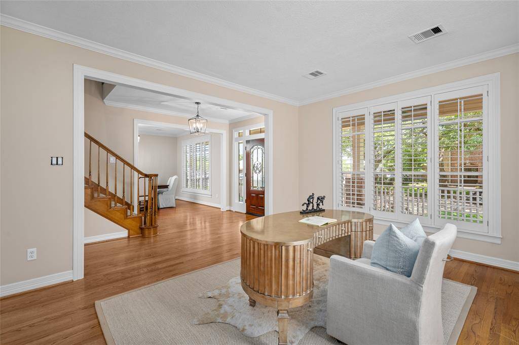 With plantation shutters and hardwoods, the space is sophisticated yet comfortable.