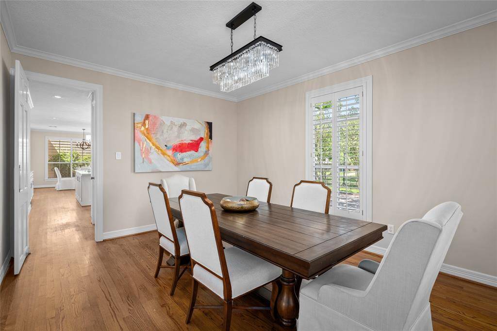 This elegant dining space flows to the kitchen with a sizable walk-in pantry.
