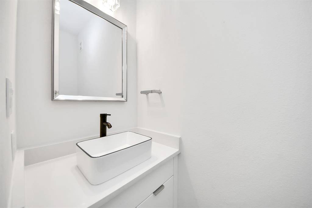 The half bath is located in the living room.