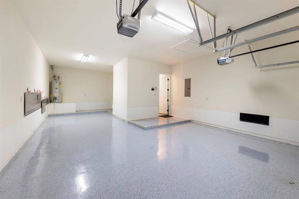 Epoxy-coated 3-car garage with storage for the high-end flood safe barrier system.