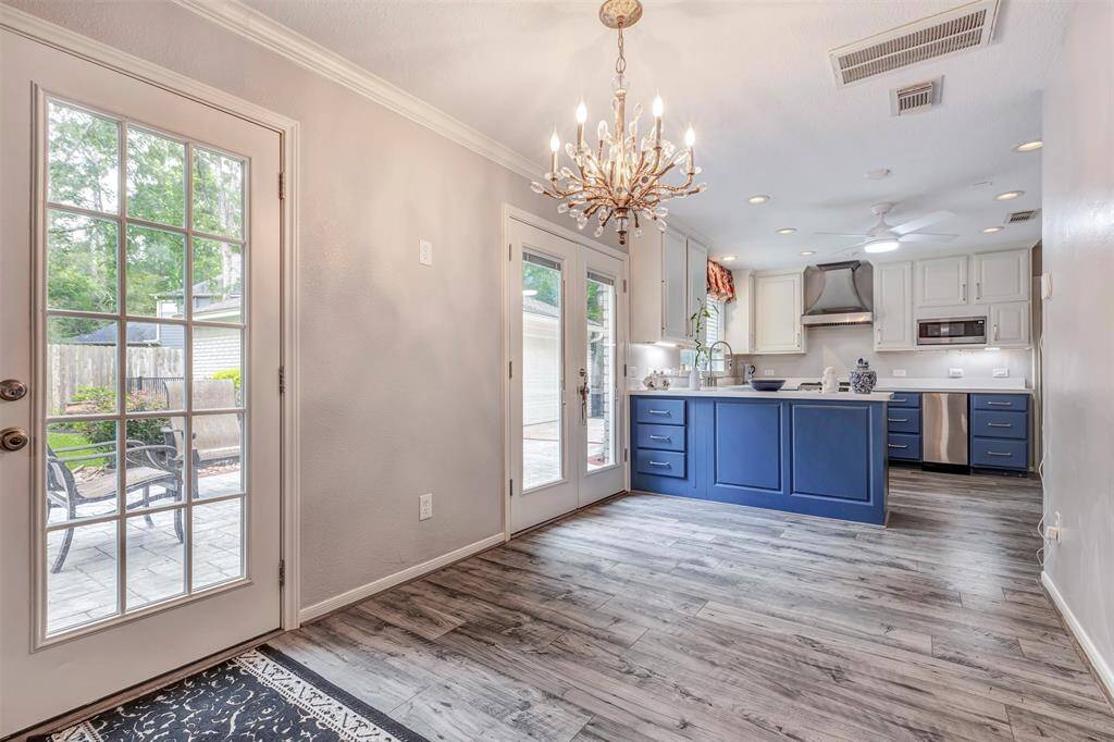 Enjoy seamless indoor-outdoor living with dual patio doors connecting the kitchen and breakfast area to the outside.
