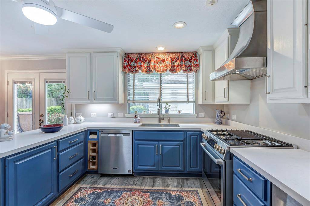 Elegant quartz countertops and a convenient built-in wine rack. Large, deep sink with pull down sprayer faucet.