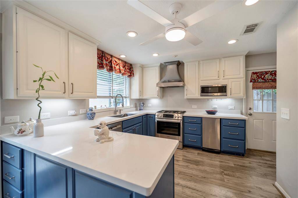 Brand-new stainless steel appliances enhance the kitchen's modern appeal.