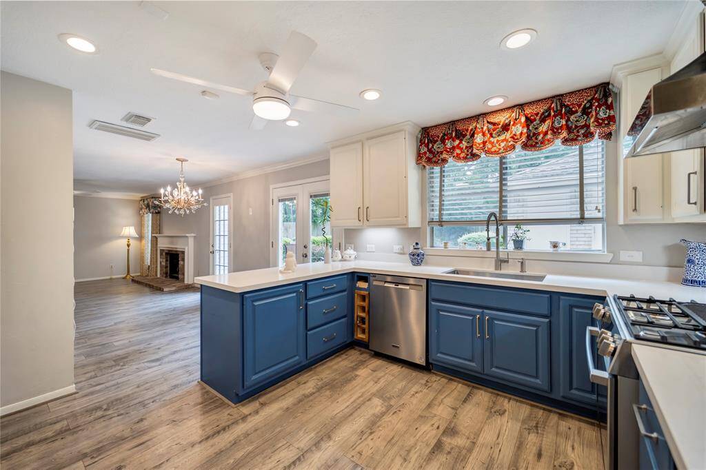 Featuring a spacious deep farm sink with a sleek new restaurant style pull down faucet.