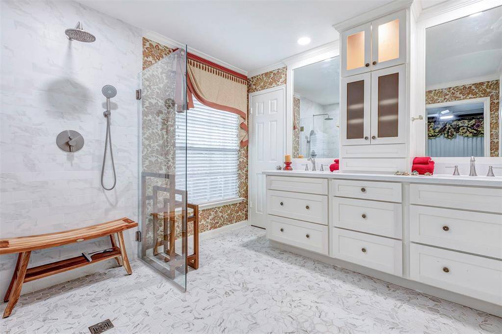 Stunning primary Custom walk-in shower with dual shower heads.