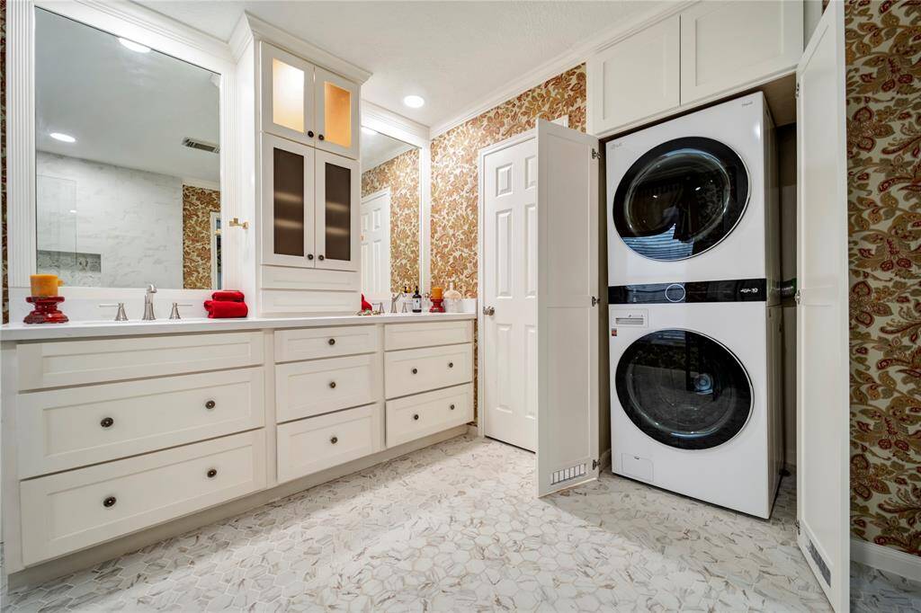 LG large capacity washer and dryer located in the primary bath make laundry a breeze.
