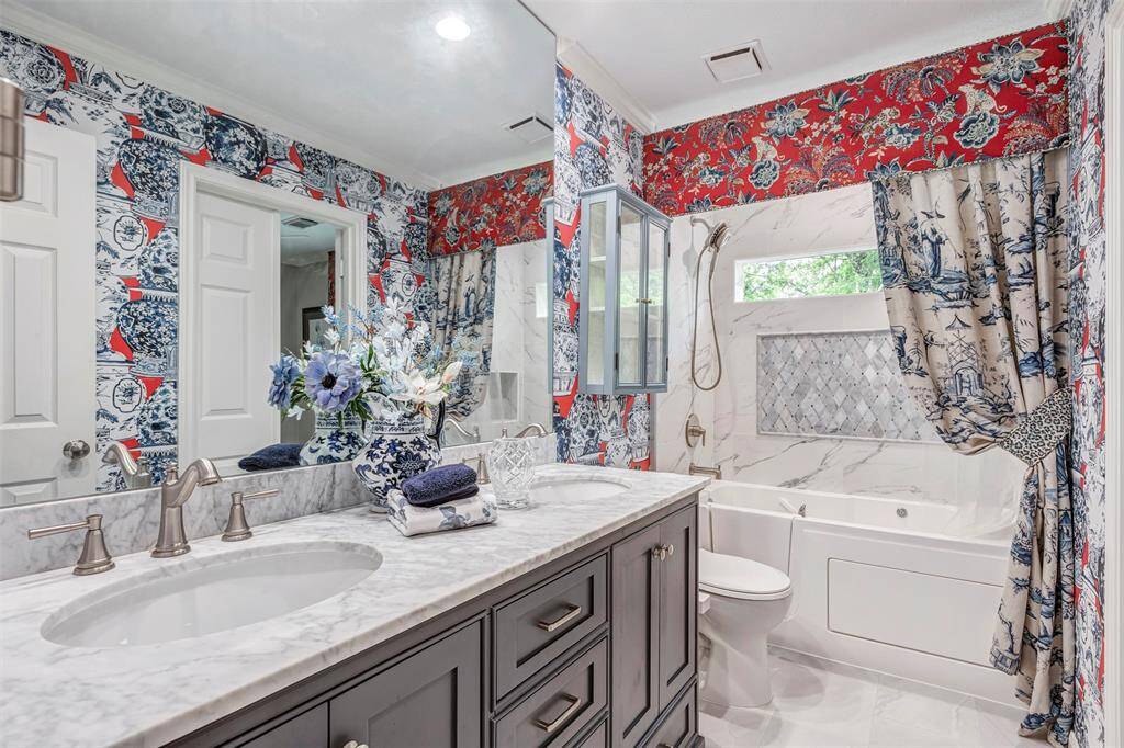 Completely remodeled upstairs bathroom, walk-in tub/shower combo.  Quartz countertops and double sinks.  All new custom cabinets.