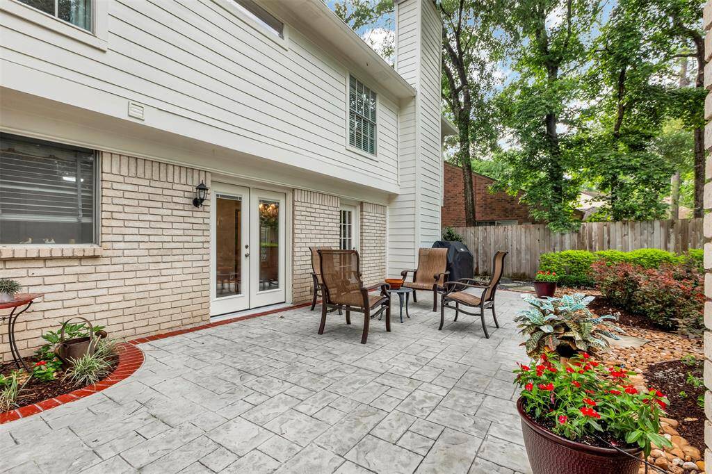 The walkway from the garage, you will find French doors opening into a charming breakfast area.