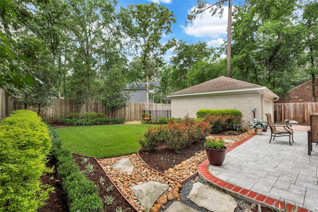 Expansive, lush lawn perfect for family fun and relaxation.