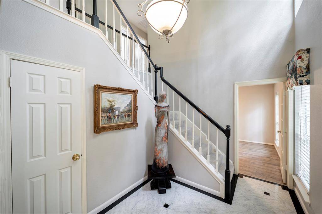 Grand 2 story entry with convenient coat closet.