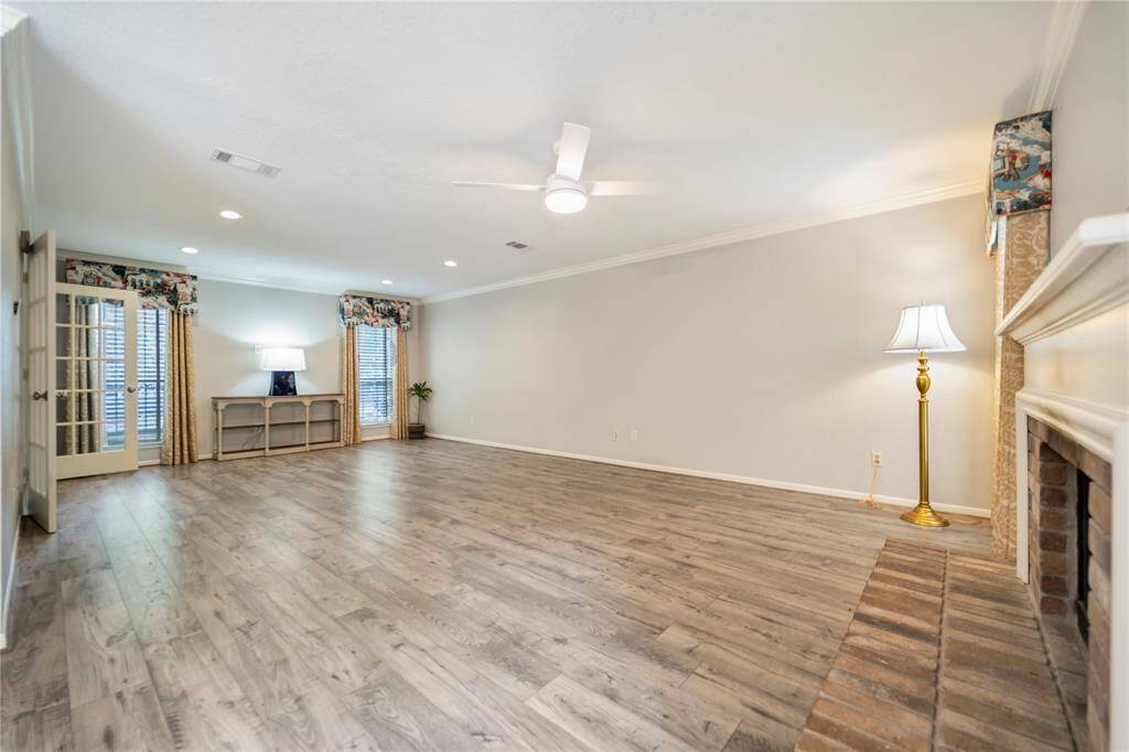 This family area has new wood look water proof laminate flooring.  Nive windows at the front of the home for natural light.