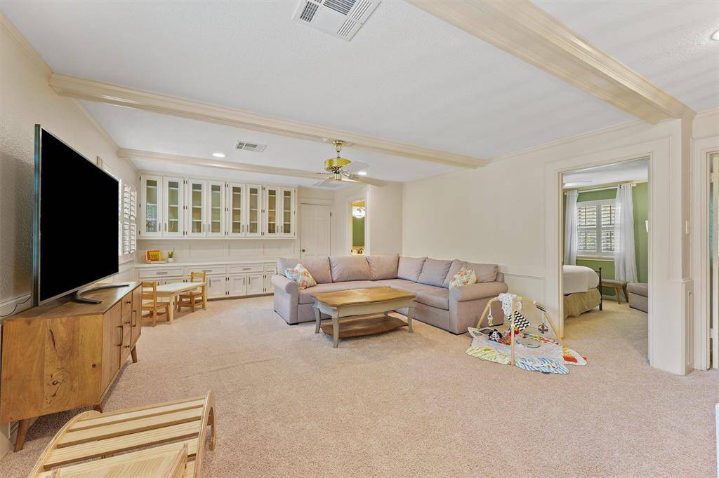 Upstairs you will find the huge game room.  The built-ins are perfect for storing toys!  Game room has direct access to one of the two bathrooms and 3 upstairs secondary bedrooms.