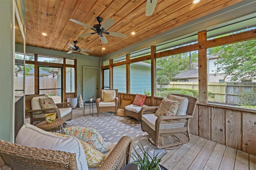 Your very own screened-in porch with wooden ceiling treatment and 3 ceiling fans to keep you cool year round. It features views of the fenced backyard and secondary deck, creating a perfect space for relaxation and entertaining.  Imagine enjoying your morning coffee or evening glass of wine without worry about mosquitos!