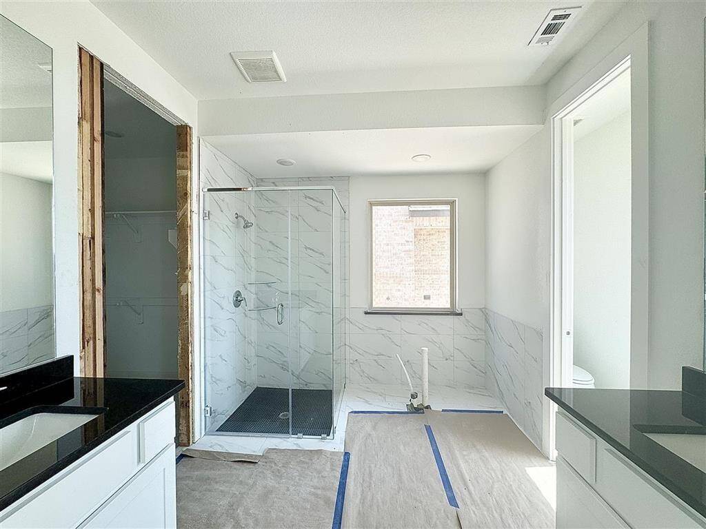 Imagine a sleek freestanding tub right below that window!