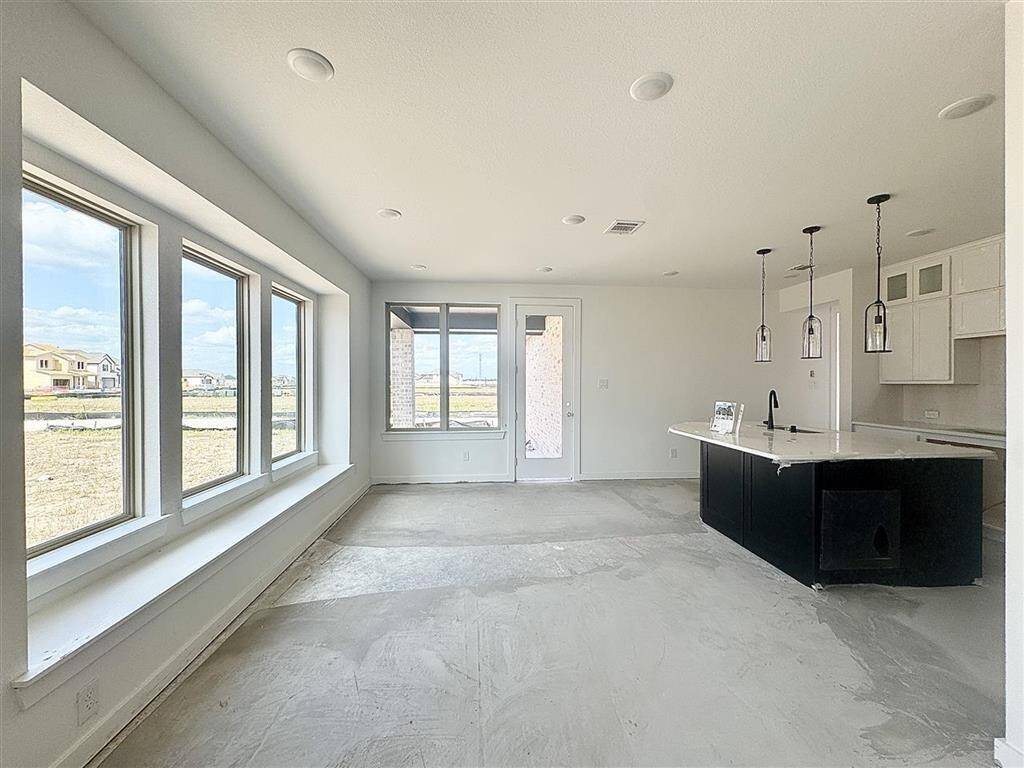Window seat PLUS a table PLUS bar stools at the island? Theres plenty of space to host that dinner party!